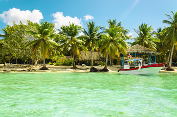 Boat on azure water  on a background of exotic beach
