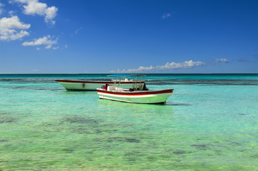 Boats on the azure sea on a background of blue sky