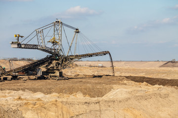 Fototapeta na wymiar Opencast brown coal mine. Giant excavator.