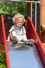 Boy playing on slide