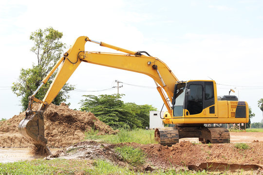 Heavy excavator loader at soil moving works