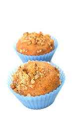 Walnut Muffin in blue silicon cups isolated on white