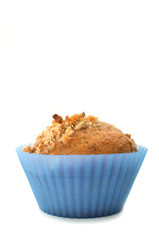 Walnut Muffin in blue silicon cups isolated on white
