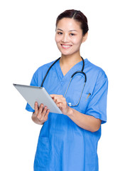 Woman doctor use tablet