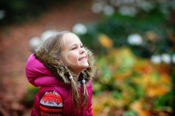 cute girl at autumn day in the park