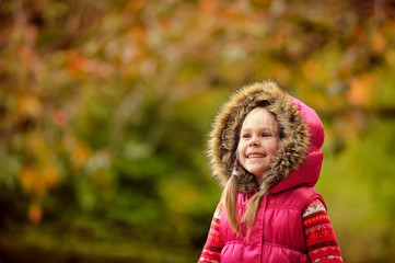 Fototapeta premium cute girl at autumn day in the park