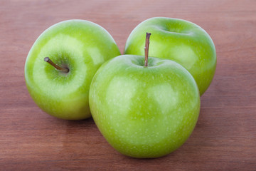 Fresh Green apples on the wooden table