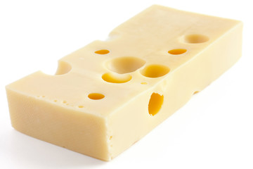 Block of swiss type cheese on white