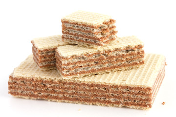 Vanilla wafer biscuits with chocolate filling. Bite missing.