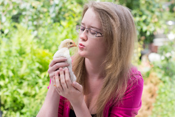 girl with a small chicken