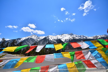 Tibetan Prayer Flags on Snow Mountains