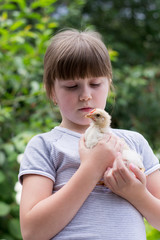 little girl with a little chicken