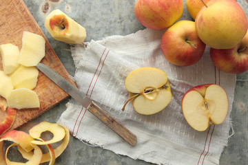Apples half sliced and peel off by knife
