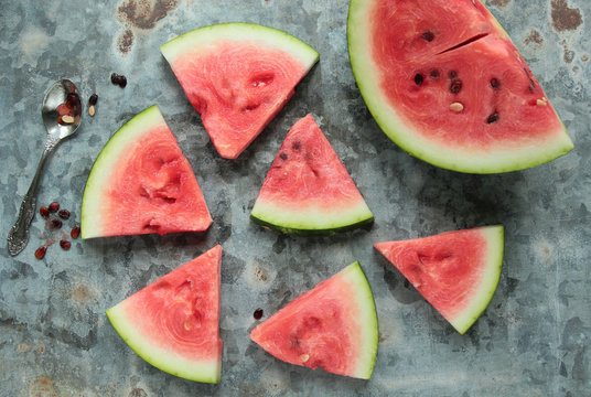 Pieces of watermelon on a  metal board