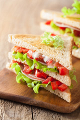 sandwich with ham tomato and lettuce