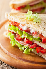 sandwich with ham tomato and lettuce
