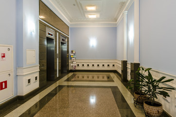 entrance of a residential building with an elevator