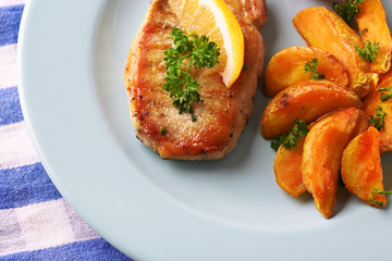 Grilled steak, grilled vegetables and fried potato pieces