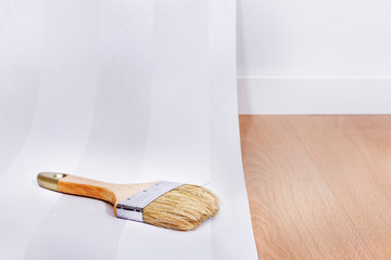 Paper and Paint brush in interior room