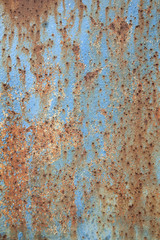 rusty metal with peeling blue paint