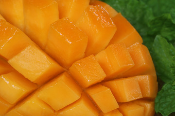 Sliced mango with green mint