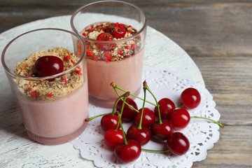 Tasty cherry dessert on wooden table