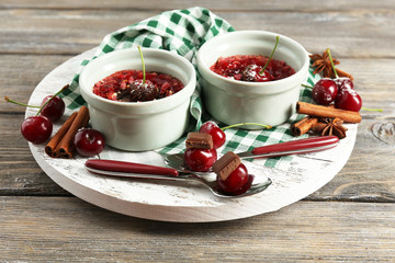Tasty cherry dessert on table