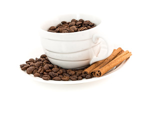 Cup with coffee beans on white background