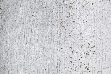 board with peeling white and grey paint