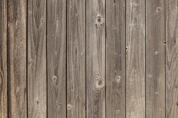 old grey planks with fading brown varnish