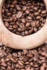 Roasted coffee in wooden bowl