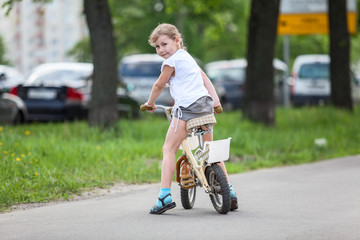 Happy girl riding a bicycle
