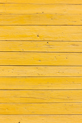 Obraz premium old planks with bright yellow paint