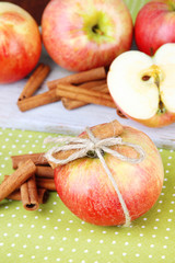 Ripe apples with with cinnamon sticks