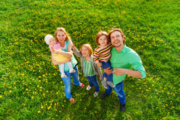 Smiling family portrait from above in park