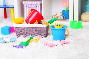Colorful toys on fluffy carpet in children room