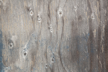 grey wood with knots and blue paint