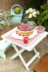 Tasty cake with fresh berries on table, close up