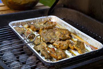 Grilled pork on a tray in the garden