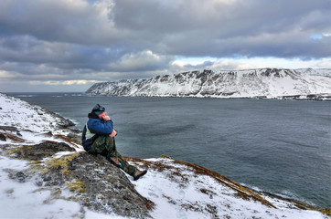 Man enjoy the Norwegian sea coast nature