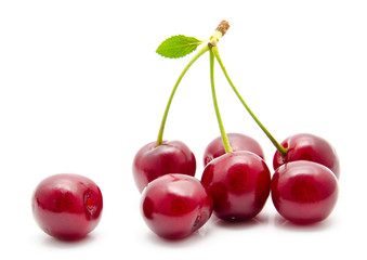 Juicy cherry with leaf isolated