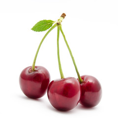 Juicy cherry with leaf isolated