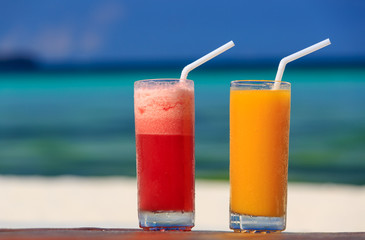 mango and watermelon cocktails on tropical beach