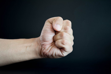 Hand of the Power Punch on Black Background