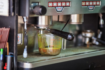 make coffee by Espresso amaricno Machine in coffee