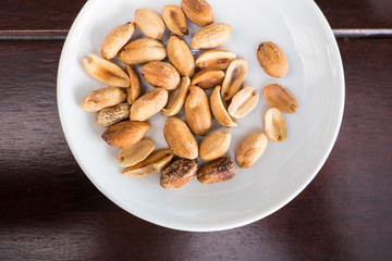 Salt roasted peanut in white plate