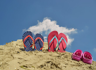 beach background -  pink and blue shoes and sangdals