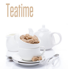 utensils for teatime and brown sugar, isolated