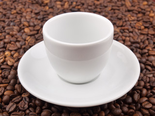 A white cup on beans background