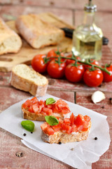 Tomato bruschetta - bread toast with tomatoes, garlic